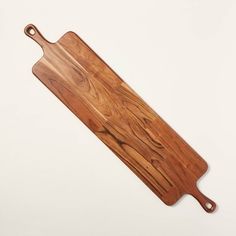 a wooden cutting board on a white background