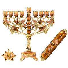 an elaborately decorated menorah with candles and other items around it on a white background