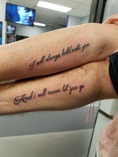 two people with tattoos on their arms that say, i will always hold onto you