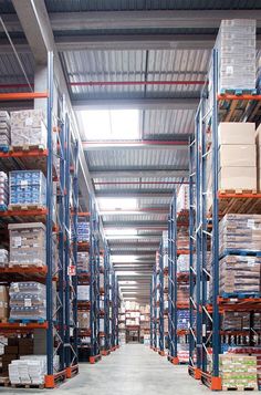 an empty warehouse filled with lots of shelves