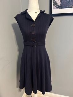 Look at the details in the pictures. Comes with belt. Fits like an extra small petite Blue Fitted Belted Dress With Short Sleeves, Formal Fitted Belted Dress With Buttons, Chic Blue Belted Dresses, Vintage Belted Formal Dress, Vintage Formal Belted Dress, Fitted Midi Length Belted Dress With Buttons, Fitted Knee-length Belted Dress With Buttons, Elegant Blue Belted Dress For Formal Occasions, Knee-length Fitted Belted Dress With Buttons