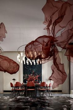 an artisticly designed dining room with red chairs