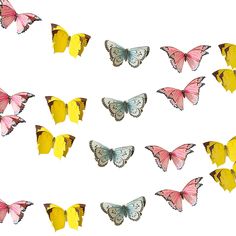 many different colored butterflies flying in the air