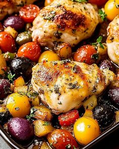 chicken, potatoes and cherry tomatoes in a roasting pan