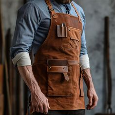 Immerse yourself in a floral fusion with a handcrafted apron that brings together an array of blooming patterns, offering a garden-inspired culinary aesthetic. Fantasy Apron, Culinary Aesthetic, Workshop Clothes, Leather Tool Apron, Leather Shop Apron, Apron With Leather Straps, Leather Apron, Guy Stuff, Brand Board