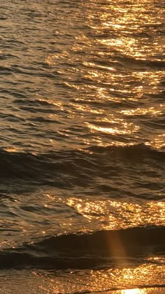 the sun shines brightly on the water as it reflects off the ocean's surface