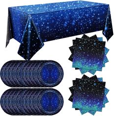 a table cloth and place mats with blue stars on the top are set next to each other