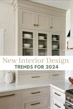 a kitchen with white cabinets and gold trim on the countertops, is featured in new interior design trend for 2020