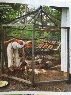 a woman bending over in a chicken coop