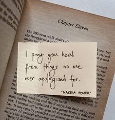 a piece of paper that has been placed on top of an open book with the words i pray you heal from things no one ever applied for