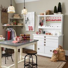 a room filled with lots of clutter and storage space next to a white table