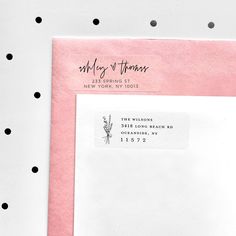 a pink envelope with black polka dots on it and the address stamp reads, wedding of thomas