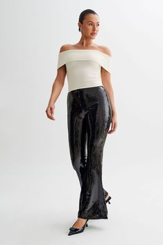 Zero disco ball required.The WILMA are a pair of sparkling wide-legged pants with a high waistline and flared hems. An invisible zipper closure at the side seam gives it a sleek, seamless silhouette. The legs transition into a flattering bootcut that complements its high, fitted waist. Lined sequinned fabrication adds a touch of comfortable glam, making these pants the perfect choice for all-night wear. Black Sequin Pants, Sequin Pants, Night Wear, Disco Ball, Black Bodysuit, Invisible Zipper, Nightwear, Latest Fashion Trends, Black Pants