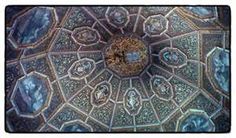 an intricately designed ceiling in the middle of a room with many different designs on it