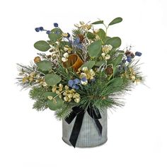 a vase filled with lots of different types of flowers