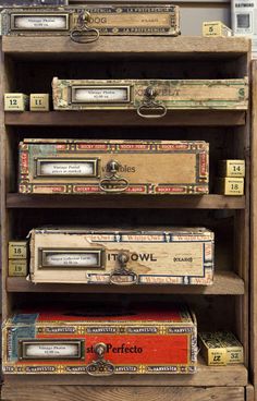 several books are stacked on top of each other in an old bookcase that is being used as a storage unit