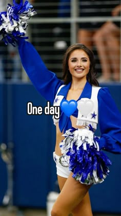 a cheerleader is holding her pom poms in one hand and smiling at the camera