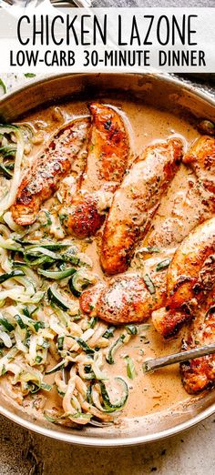 a pan filled with chicken and noodles on top of a table