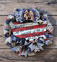 a patriotic wreath that says home is the free because of the brave