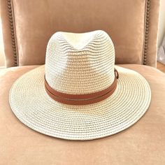 Soft Shaped Straw Hat In Apricot/Cream Color With Faux Brown Leather Band. Straw And Faux Leather. Panama Style. Fits Up To 22” With Inner Straps To Fit Smaller. Tags: Summer Spring Vacation Resort Festival Concerts Barbiecore Mermaid Mermaidcore Beach Coastal Cowgirl Music Fun Chic Cream Straw Hat For Vacation, Cream Wide Brim Fedora For Travel, Chic Cream Fedora Sun Hat, Cream Brimmed Fedora For Vacation, Cream Fedora For Vacation, Chic Cream Hat For Vacation, Chic Beige Hat For Day Out, Classic Beige Sun Hat For Day Out, Cream Summer Fedora