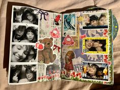 an open scrapbook with pictures and stickers on the pages is laying on a bed