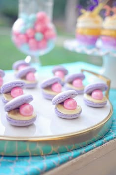 small desserts are displayed on a tray