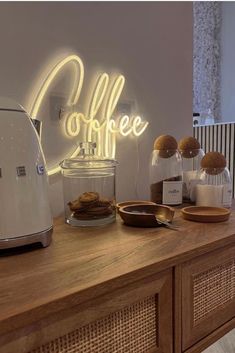 the coffee bar is decorated with neon lights and cookies on it's countertop