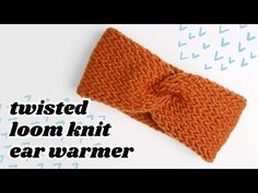 an orange knitted headband with the words twisted loom knit ear warmer