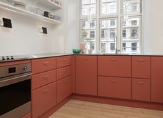 a kitchen with an oven, dishwasher and cabinets in it's center