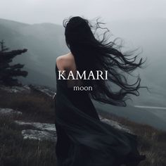 a woman with long hair standing on top of a hill in front of the words kaamari moon