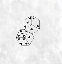 two dices with hearts on them are floating in the air and one is falling down