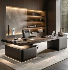 an office desk with a laptop on it in front of a book shelf and bookshelf