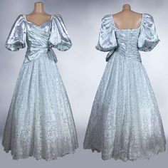 This Is An Incredible Vintage 1980's Formal Dress Made By "Candi Jones California". It Is Made Of Silver Metallic Mylar Fabric, White And Silver Metallic Lace, And White Taffeta- (47% Nylon/ 53% Miler). It Features A Draped And Ruched Bodice With A V Neckline, Fitted Asymmetrical Waist, And Insane Pouf Bubble Sleeves. The Sleeves Can Be Worn On Or Off The Shoulder And Have Elastic Tops. It Has A Full, Ball Gown Sweep That Is 3 Layers With A Left Hip Bow- Sheer Silver Metallic Lace, Solid Taffeta In White, And An Attached Crinoline. It Is So Gorgeous And So Over The Top 80's Avant-Garde! Labeled A Size 7/8- Vintage Sizing Does Not Equal Modern Sizing, Please Use The Measurements For An A Ball Gown Prom Dress, Black Lotus, Gown Prom, Bubble Sleeve, Metal Lace, Ruched Bodice, Prom Dresses Ball Gown, 80s Fashion, Character Outfits