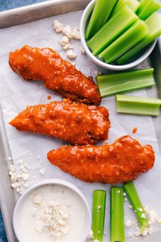 chicken wings and celery sticks on a tray