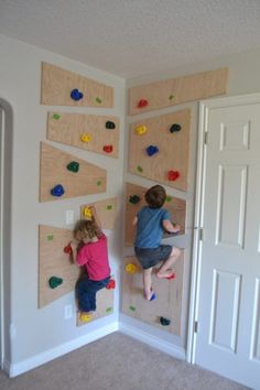 two children climbing on the wall in their bedroom