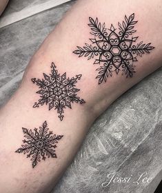 a snowflake tattoo on the leg