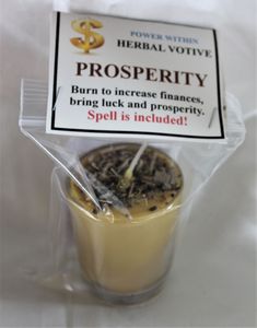 a cup filled with tea sitting on top of a plastic wrapper next to a sign