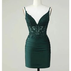 Berlinnova Us Dark Green/ Emerald Homecoming Dress With An Open Back. It Is A Corset Top With Lace And A Bottom Satin Material. It Is Size 12, Unworn/Never Used Green Mini Dress With Fitted Bodice For Prom, Dark Green Fitted Evening Dress, Green Spaghetti Strap Mini Dress For Prom, Green Spaghetti Strap Evening Dress For Prom, Elegant Dark Green Mini Dress, Elegant Fitted Dark Green Mini Dress, Green Cocktail Dress With Sweetheart Neckline, Green Cocktail Evening Dress With Sweetheart Neckline, Elegant Sleeveless Dark Green Mini Dress