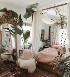 a bed room with a large mirror and lots of plants