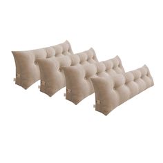 four beige pillows are lined up against each other