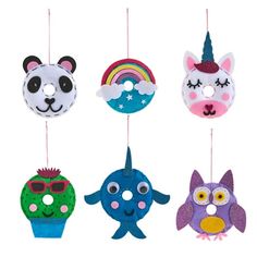 four different animal masks hanging from strings