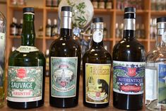 several different types of wine bottles lined up on a table