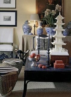 a living room filled with lots of furniture and pictures on the wall next to each other