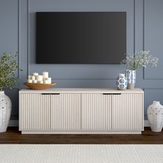 On-trend texture and design combine in this transitional TV stand. With a wood grain finish and textured fluting, this piece is sure to be a statement in your living room, den, or game room. The plinth base gives an illusion of a seamless transition from your floor, while the rounded front corners create a softer modern shape. The console features 4 fully enclosed doors with 4 inner shelves, allowing for ample storage for your devices, games, books, and more. Color: Alder White | Latitude Run® S Tv Console Decorating, Transitional Tv Stand, White Tv Stands, Living Room Tv Stand, Coastal Living Room, Grey Flooring, Living Room Inspo, Living Room Tv, New Room