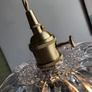 a golden faucet on top of a glass table