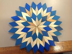 a blue and white circular object on a wooden table