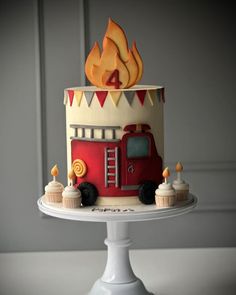 a birthday cake with a fire truck on top