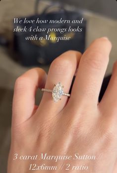 a woman's hand with a diamond ring on it and the words, we love how modern and sleek it class prongs looks with a manicure