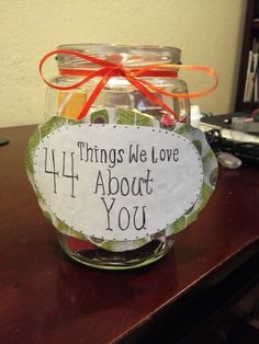 a jar filled with candy sitting on top of a table