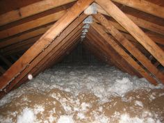 an attic with white foam on the floor